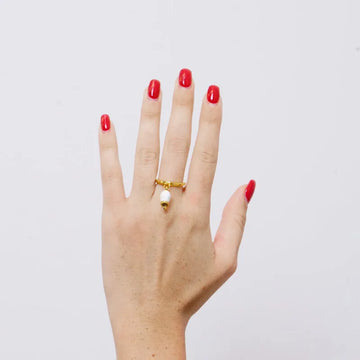Anello in Acciaio con campanella portafortuna bianca e oro