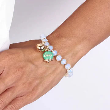 Bracciale in Metallo campanella verde e piccolo sonaglio con pietre bianche